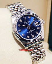 Load image into Gallery viewer, Rolex 178274-0048 features blue dial, diamond indexes and fluted