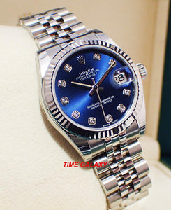 Rolex 178274-0048 features blue dial, diamond indexes and fluted