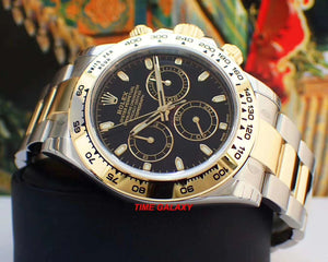 116503-0004 black dial with snailed counters features 18 ct gold applique hour markers and hands in Chromalight