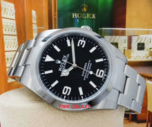 Load image into Gallery viewer, Rolex 214270 features black dial, mixed indexes and stick hands