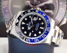 Load image into Gallery viewer, Rolex 116710blnr-0002 features black dial, black and blue Cerachrom bezel
